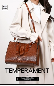 Brown crocodile embossed faux leather handbag with shoulder strap on beige trench coat
