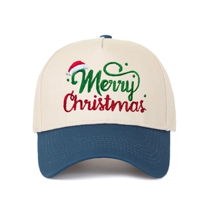 Close-up of Merry Christmas embroidery and red hat icon on a beige baseball cap