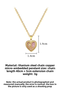 Detail showing gold heart pendant necklace with pink inlay and floral zircon accent