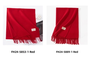 Detail of red tassels and 'Day April' woven labels on elegant cashmere-feel scarves
