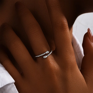 Close-up of adjustable S925 sterling silver hug ring featuring micro-pave cubic zirconia