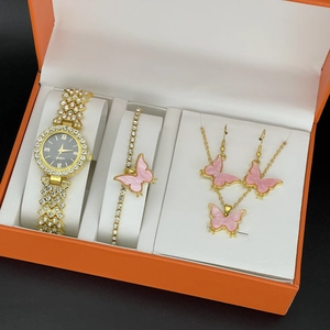 Elegant gold quartz watch set with pink butterfly accents and sparkling crystals in gift box