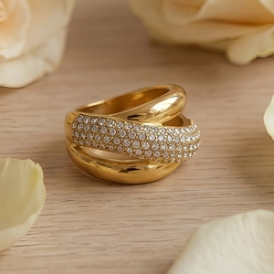 Macro detail of gold layered titanium steel ring with sparkling pavé cubic zirconia