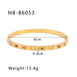 Detailed view of 18K gold plated square bangle with colored gemstones and size markings