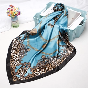 Vintage leopard print square satin scarf with gold chain pattern on blue background