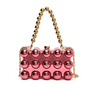 Chic pink acrylic sphere bubble handbag with gold beaded handle and metal chain strap
