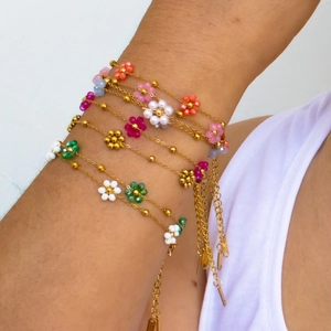 Bohemian colorful handmade floral beaded necklace and bracelet set on a model