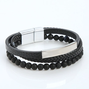 Macro shot of multi-layer leather bracelet with volcanic stone beads and silver magnet clasp