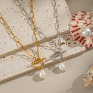 Detail of gold and silver paperclip necklaces with toggle clasp and freshwater pearls