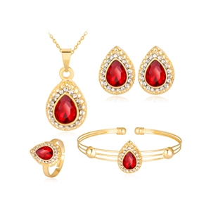 Luxury gold jewelry set featuring red pear-cut stones and crystal accents on white background