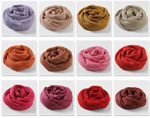 Grid view showing variety of colorful cotton linen scarves in 12 different shades