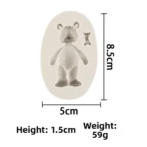 Macro shot of bear and bowknot silicone mold with clear 8.5x5cm size markings