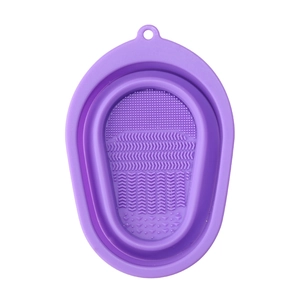 Purple collapsible silicone makeup brush cleaning bowl with multi-textured surface