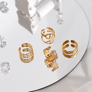 Set of four 18k gold plated stainless steel open rings with elegant hollow geometric designs