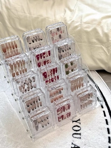 Multi-tier clear acrylic display stand with boxes for artificial nails and badges
