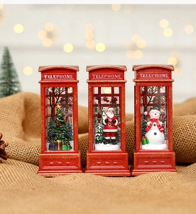 Three retro red Christmas telephone booths featuring Santa, snowman, and tree decor
