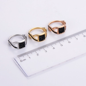 Square signet rings in silver, gold, and rose gold with black zircons and size ruler