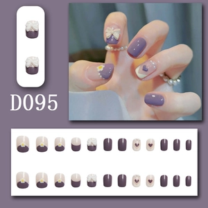 French press-on nails set with purple daisy flowers and 3D bowknot decor in D095 style