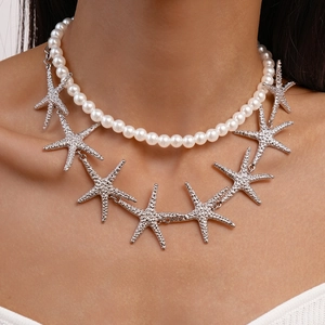 Double-layered necklace set featuring white faux pearls and silver starfish pendants