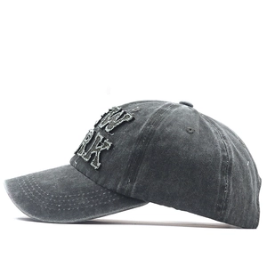 Detail of vintage washed grey baseball cap with 3D New York letter embroidery