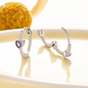 Silver-colored heart hoop earrings with purple zircon stones in a minimalist design