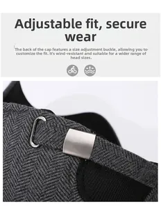 Detail view of the silver metal adjustment buckle on a gray herringbone wool winter cap