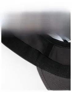 Macro detail of breathable sweatband and plaid lining inside cotton flat top cap