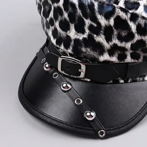 Fashionable leopard print navy hat with black PU leather brim and silver rivet details