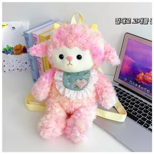 Detail of pink and white plush sheep backpack with yellow straps in a desk setting