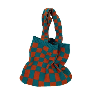Knitted checkerboard tote bag in bright orange and teal blue with thick soft texture