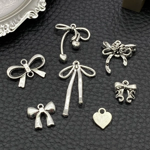 DIY silver alloy bow charms and heart pendants for making handmade jewelry accessories
