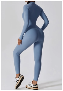 Rear view of high-elasticity light blue yoga jumpsuit showing smooth sculpting back lines