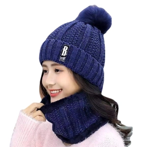 Winter knitted hat and scarf set in navy blue with thick fleece lining and faux fur pompom