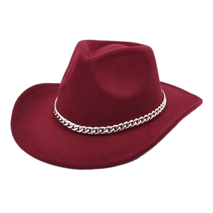 Close-up of wine red wool felt fedora hat featuring a stylish gold metal chain band