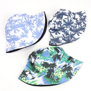 Double-sided reversible bucket hats with tropical palm leaf and landscape prints