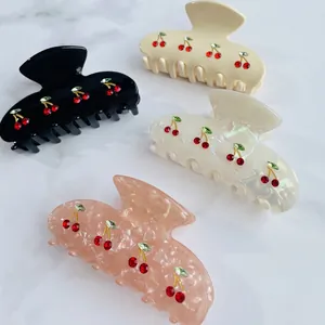 Pastel cherry rhinestone claw clips in black, cream, pearl white, and pink marble finish