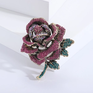 Luxurious rose flower brooch with pink rhinestones and antique gold metal base