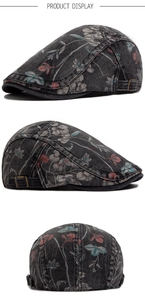 Detailed view of washed denim beret with floral print and adjustable metal buckle