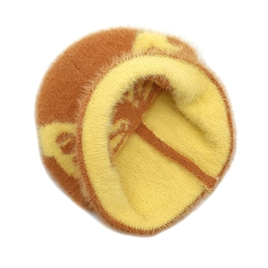 Close-up of orange and yellow plush jacquard knit texture with fuzzy mohair finish