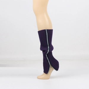 Detail of purple knitted leg warmers featuring a full-length silver zipper on a model