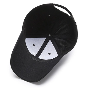 Interior view of black cotton baseball cap showing reinforced seams and metal buckle strap