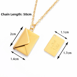Macro view of gold envelope locket pendant showing internal Love You engraved metal plate