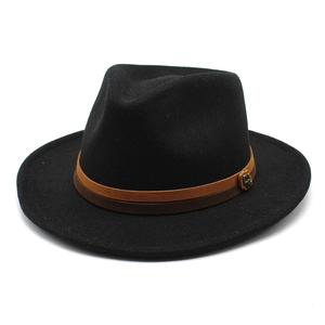 Detail of wool fedora hat featuring a dual-tone decorative band and gold metal buckle