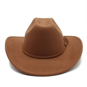 Detailed view of dark brown fedora hat with woven decorative band and stylish fringe