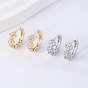 Elegant gold and silver huggie earrings with double clover leaf pave cubic zirconia stones