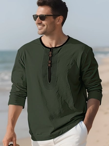 Detail of dark green cotton linen shirt featuring vintage buttons and textured fabric