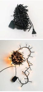 Detail of warm white LED string lights with EU plug and black cable for decor