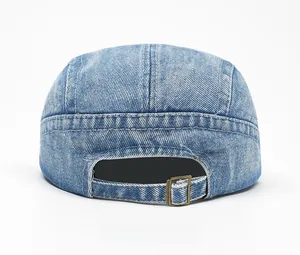 Detail of light blue denim hat back with adjustable bronze metal buckle and washed texture