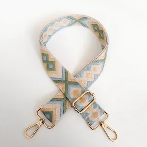 Adjustable canvas shoulder strap with geometric diamond jacquard pattern and gold hooks