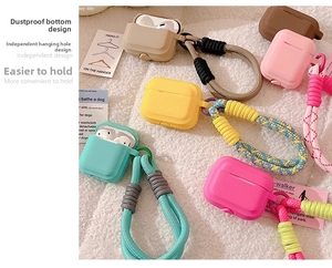 Close-up of colorful silicone case with thick braided lanyard and dust plug feature